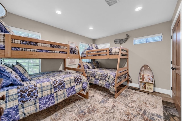 bedroom featuring baseboards, visible vents, and recessed lighting