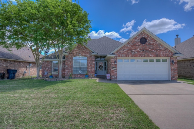 5310 Lucerne Ln, Bossier City, LA 71112 - view of front of house with a front yard, brick siding, driveway, and a shingled roof