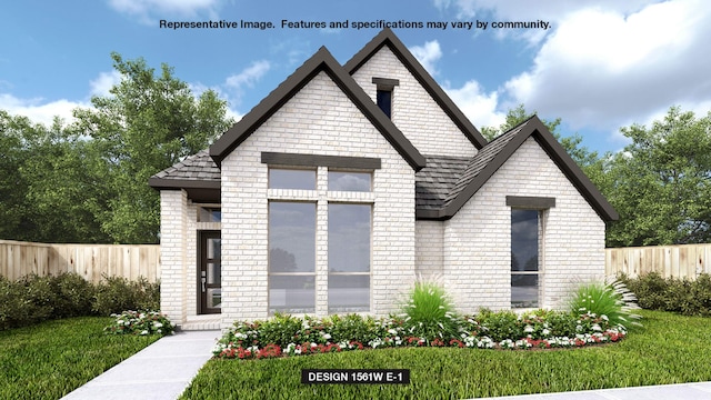 view of front of property featuring a front yard, brick siding, and fence