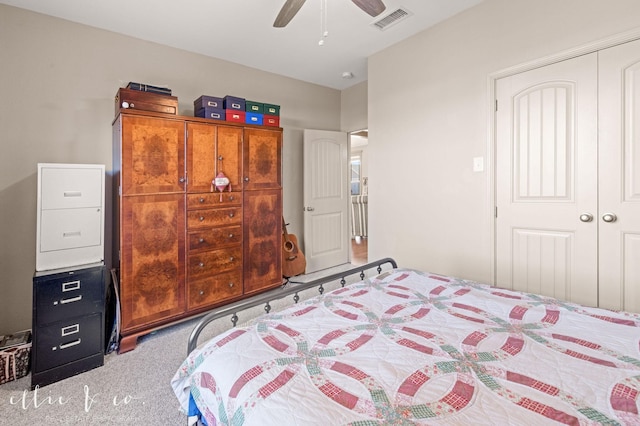 carpeted bedroom with visible vents, a ceiling fan, and a closet