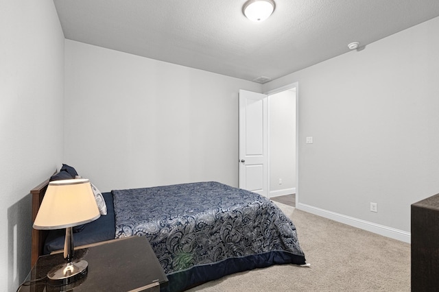 carpeted bedroom with baseboards