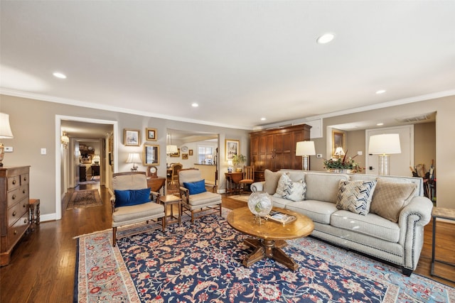 living room with recessed lighting, baseboards, ornamental molding, and dark wood finished floors
