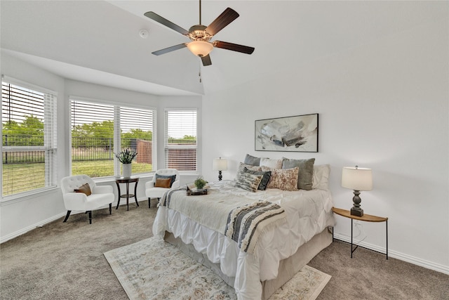 bedroom with carpet floors, a ceiling fan, and baseboards