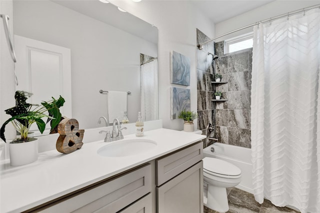 full bathroom with shower / tub combo, vanity, and toilet