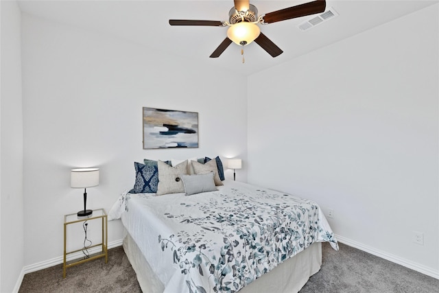 carpeted bedroom featuring visible vents, a ceiling fan, and baseboards