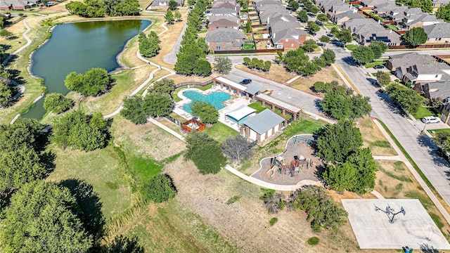 bird's eye view featuring a residential view and a water view