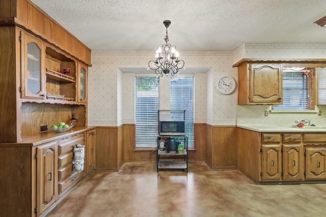 112 Charles St, Desoto, TX 75115 - dining area with wainscoting, a textured ceiling, and wallpapered walls