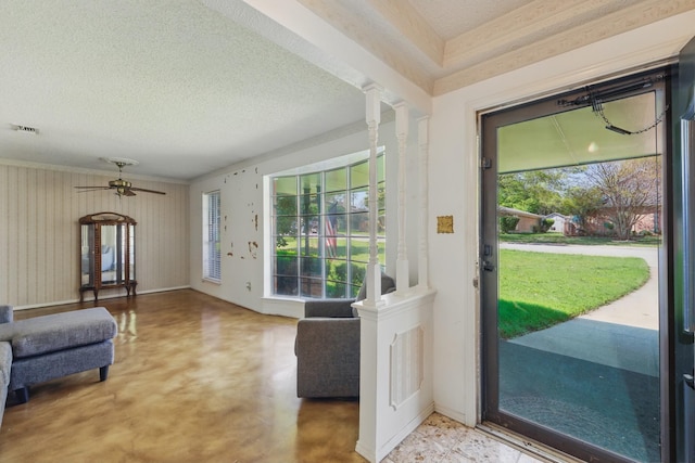 112 Charles St, Desoto, TX 75115 - entryway featuring a textured ceiling, visible vents, finished concrete flooring, ornate columns, and ceiling fan