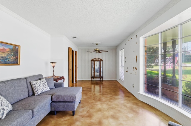 112 Charles St, Desoto, TX 75115 - living area with a textured ceiling, ceiling fan, light carpet, ornamental molding, and visible vents