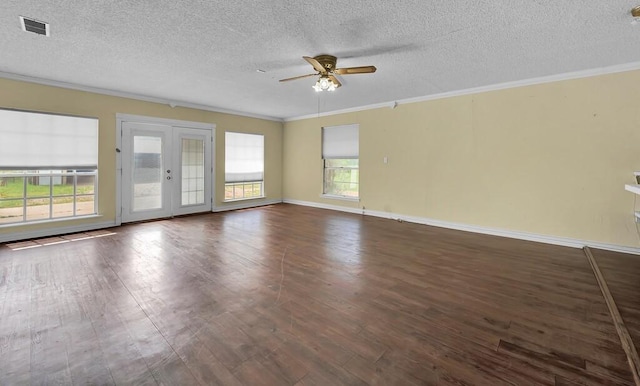 empty room featuring ornamental molding, a ceiling fan, and wood finished floors