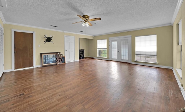 unfurnished living room featuring a textured ceiling, wood finished floors, and a ceiling fan