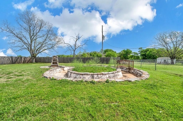 view of yard with a fenced backyard