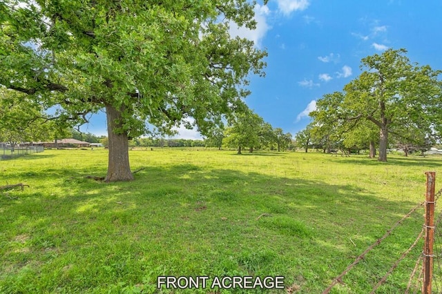 view of yard with a rural view