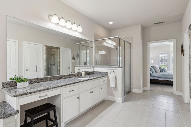 619 Southwestern Dr, Rockwall, TX 75087 - ensuite bathroom with vanity, a shower stall, tile patterned floors, and recessed lighting