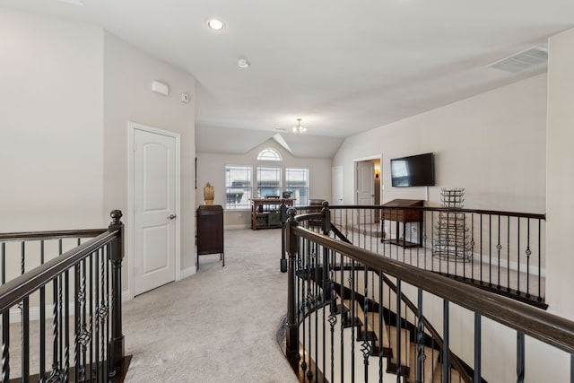 619 Southwestern Dr, Rockwall, TX 75087 - corridor featuring an upstairs landing, light colored carpet, vaulted ceiling, a chandelier, and recessed lighting