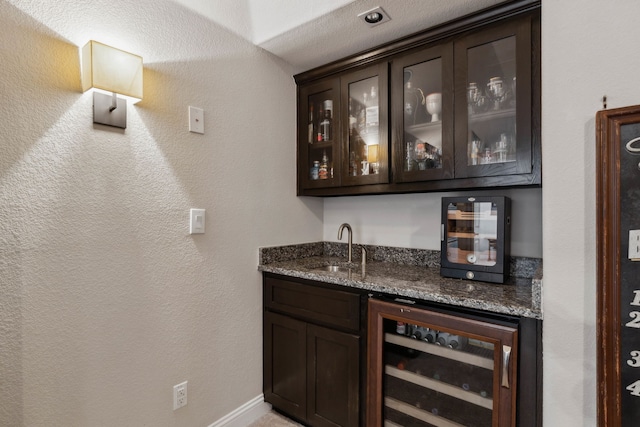 619 Southwestern Dr, Rockwall, TX 75087 - indoor wet bar with beverage cooler and baseboards