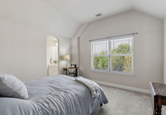 619 Southwestern Dr, Rockwall, TX 75087 - carpeted bedroom with vaulted ceiling and arched walkways