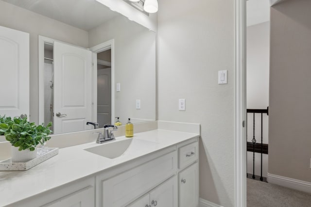 619 Southwestern Dr, Rockwall, TX 75087 - bathroom with vanity and baseboards