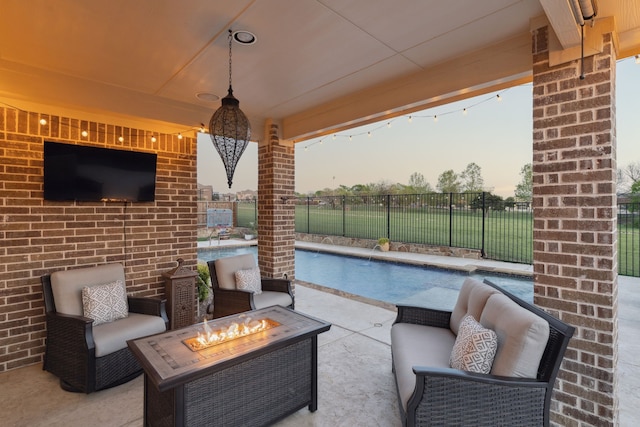 619 Southwestern Dr, Rockwall, TX 75087 - patio terrace at dusk with a fire pit and a patio