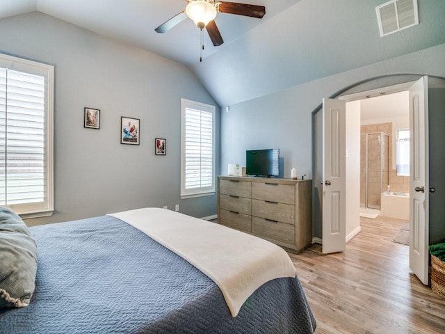 175 Balfour Dr, Fate, TX 75189 - bedroom with lofted ceiling, light wood finished floors, ceiling fan, and ensuite bath