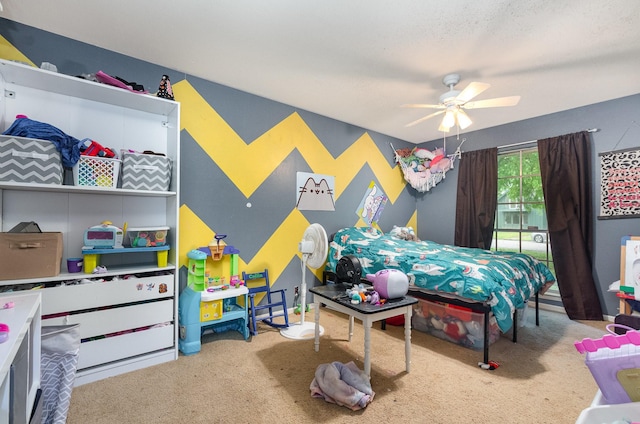 bedroom featuring ceiling fan and carpet floors