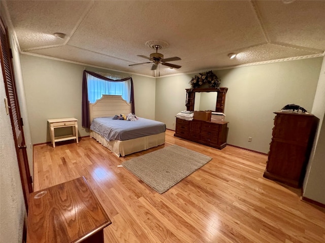 2124 Parkhaven Dr, Plano, TX 75075 - bedroom with crown molding, a ceiling fan, wood finished floors, and a textured ceiling