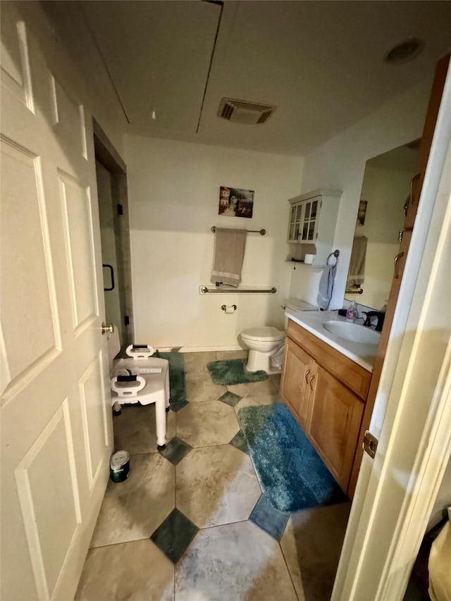 2124 Parkhaven Dr, Plano, TX 75075 - full bathroom with a shower, vanity, visible vents, and toilet