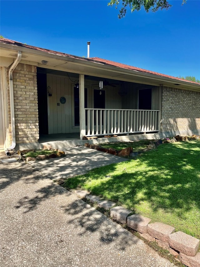 2124 Parkhaven Dr, Plano, TX 75075 - view of front of property featuring covered porch, a front lawn, and brick siding