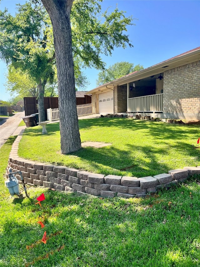 2124 Parkhaven Dr, Plano, TX 75075 - view of yard featuring a garage and fence
