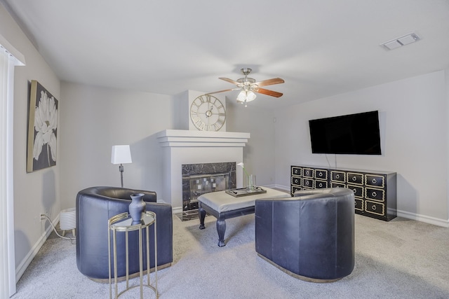 3144 Longbow Dr, Grand Prairie, TX 75052 - carpeted living room featuring a ceiling fan, baseboards, visible vents, and a high end fireplace
