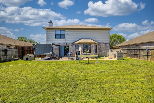 3144 Longbow Dr, Grand Prairie, TX 75052 - back of house with a lawn, a fenced backyard, and a chimney