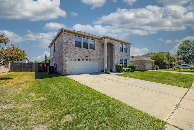 3144 Longbow Dr, Grand Prairie, TX 75052 - traditional-style home featuring a front lawn, fence, brick siding, an attached garage, and driveway