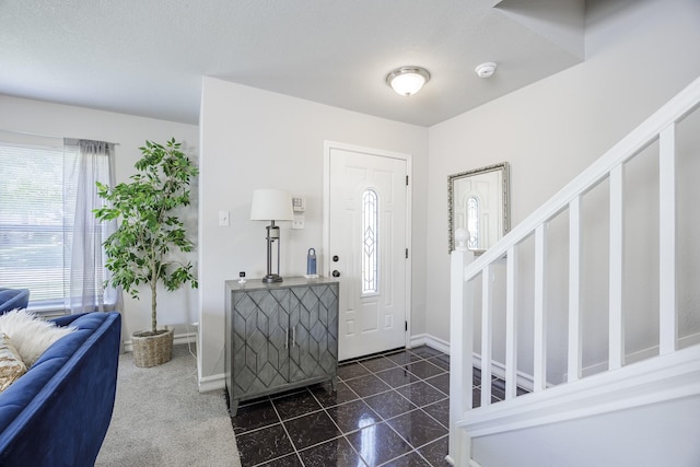 3144 Longbow Dr, Grand Prairie, TX 75052 - entryway featuring plenty of natural light, baseboards, stairs, and granite finish floor