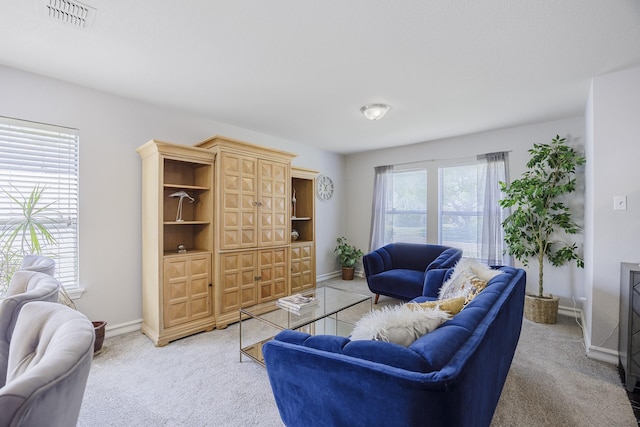 3144 Longbow Dr, Grand Prairie, TX 75052 - living room with light colored carpet, baseboards, and visible vents