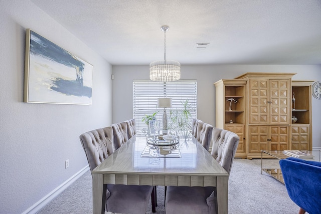 3144 Longbow Dr, Grand Prairie, TX 75052 - carpeted dining room featuring visible vents, baseboards, and a notable chandelier