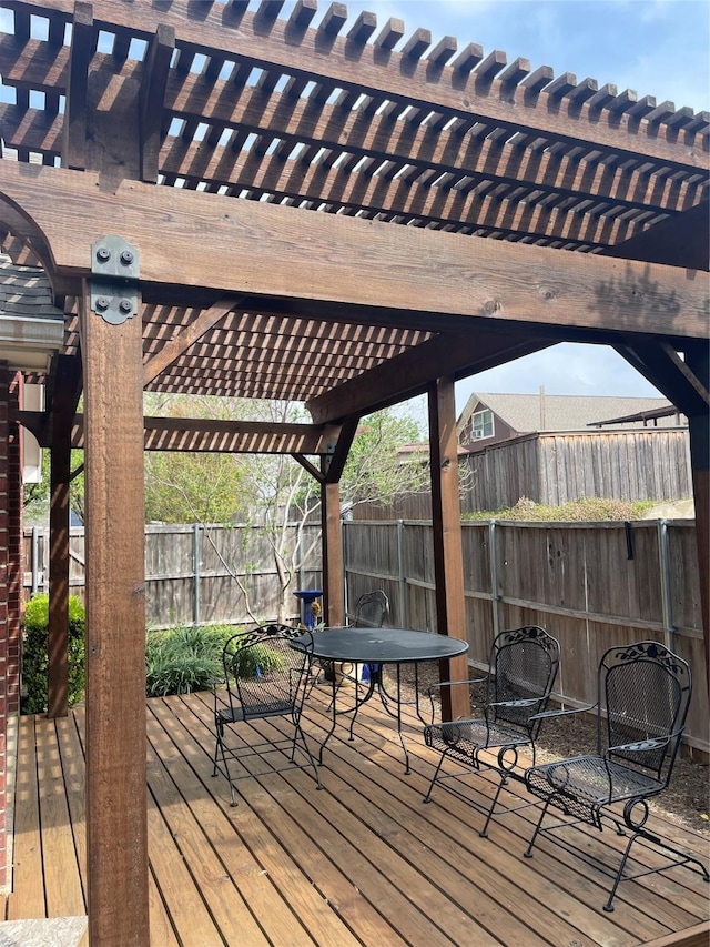 deck with fence and a pergola