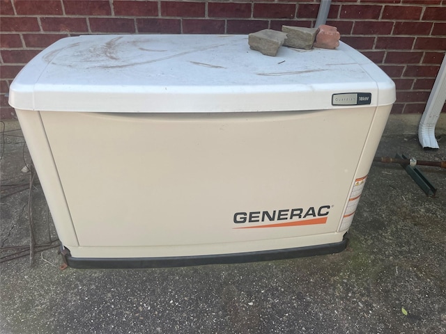 details with brick siding and a power unit
