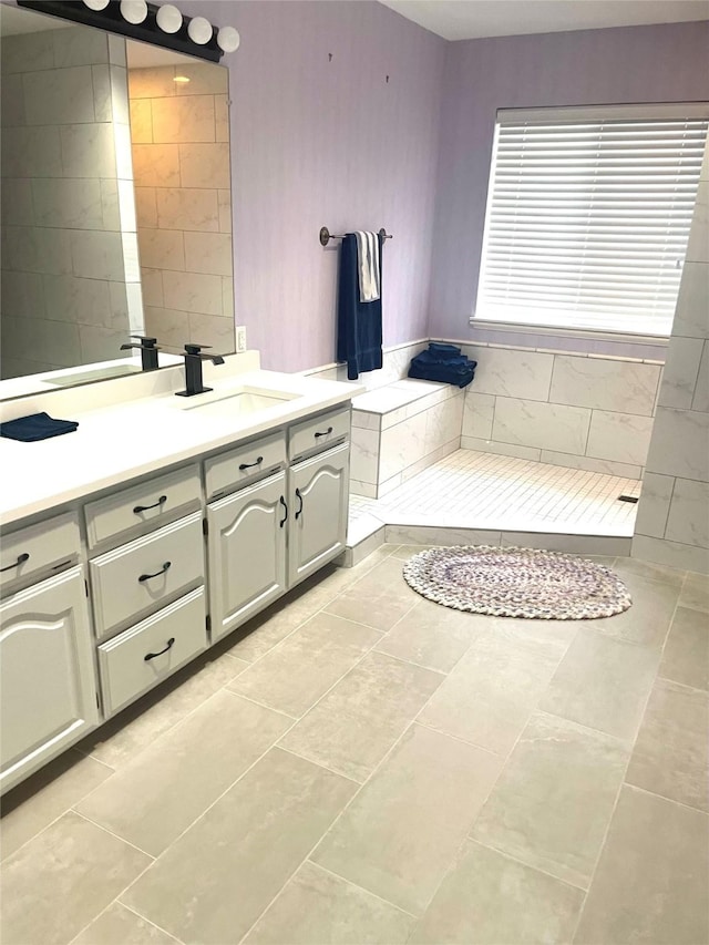 full bathroom with tile patterned flooring and vanity