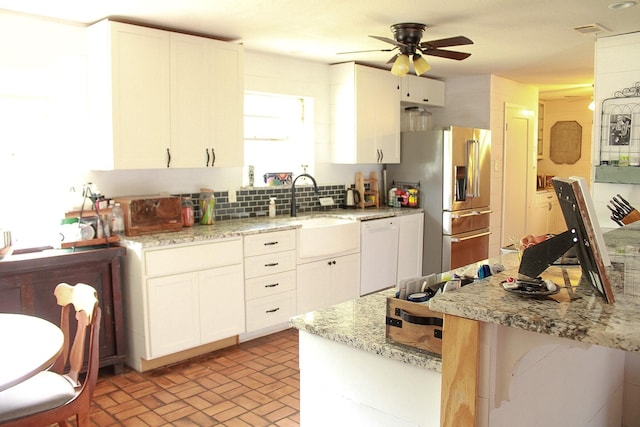 7650 Shade Tree Ln, Celina, TX 75009 - kitchen with dishwasher, a sink, stainless steel fridge, brick patterned flooring, and a ceiling fan