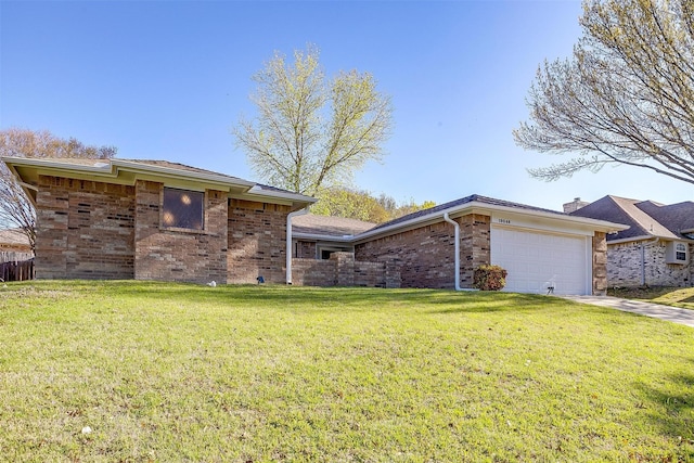 view of front of house with brick siding, an attached garage, driveway, and a front yard