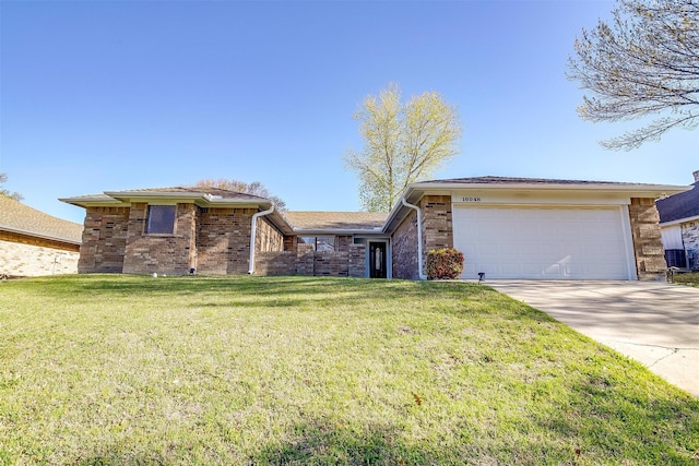 ranch-style house featuring brick siding, a garage, a front yard, and concrete driveway