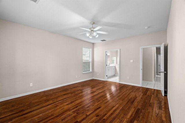 5921 Colby Dr, Plano, TX 75094 - unfurnished bedroom with ceiling fan, ensuite bathroom, visible vents, wood finished floors, and baseboards