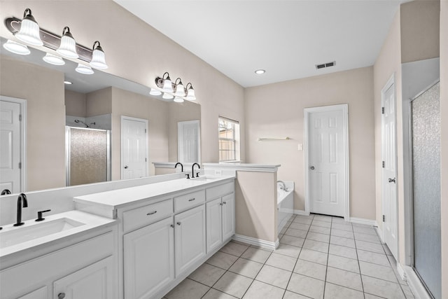5921 Colby Dr, Plano, TX 75094 - bathroom with a bath, vanity, visible vents, a stall shower, and tile patterned floors