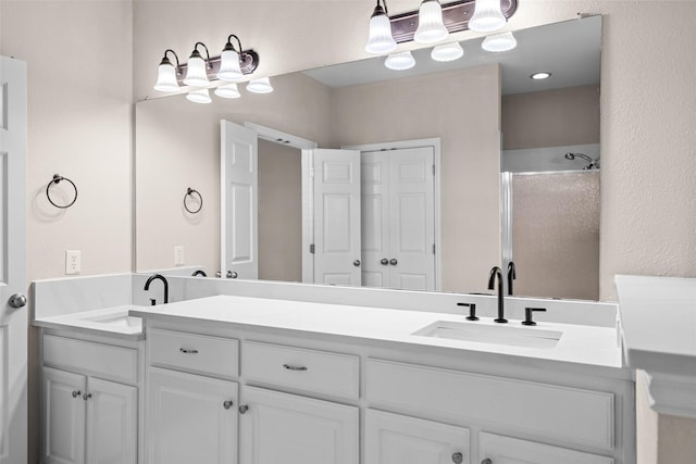 5921 Colby Dr, Plano, TX 75094 - bathroom with a sink, walk in shower, and double vanity