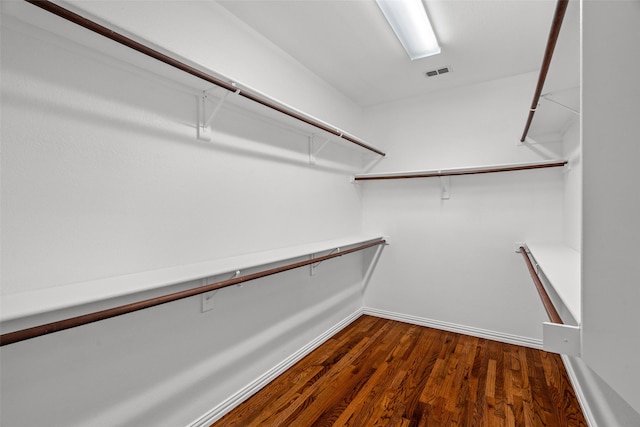 5921 Colby Dr, Plano, TX 75094 - spacious closet featuring dark wood-style floors and visible vents