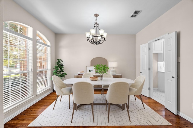 5921 Colby Dr, Plano, TX 75094 - dining room with visible vents, baseboards, an inviting chandelier, and dark wood finished floors