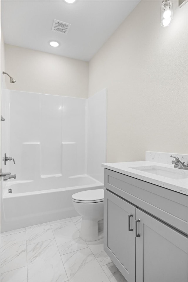 525 Galt Dr, Stephenville, TX 76401 - bathroom with vanity, toilet, visible vents, bathtub / shower combination, and marble finish floor