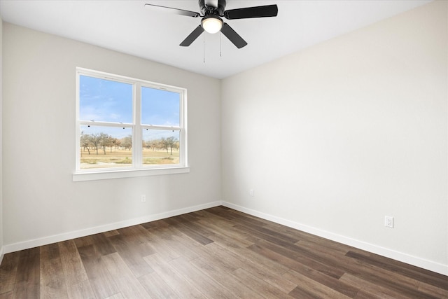 525 Galt Dr, Stephenville, TX 76401 - spare room featuring dark wood-type flooring, ceiling fan, and baseboards