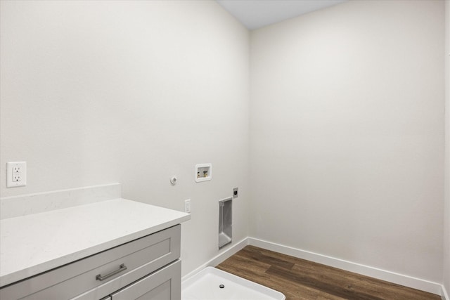 525 Galt Dr, Stephenville, TX 76401 - washroom with dark wood finished floors, electric dryer hookup, washer hookup, hookup for a gas dryer, and baseboards