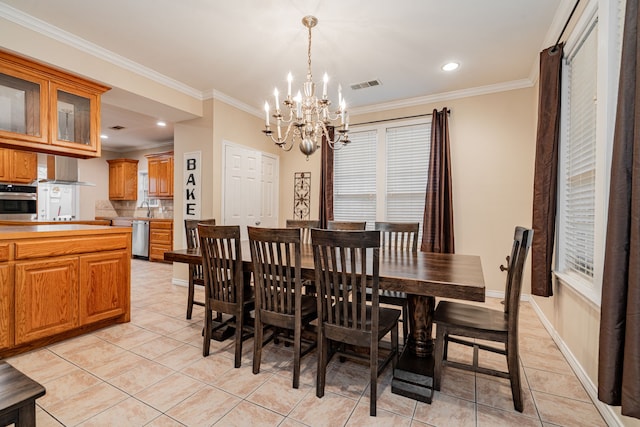 dining space featuring ornamental molding, visible vents, a chandelier, light tile patterned flooring, and baseboards